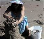 sandy feet demonstrates handstakcing sand